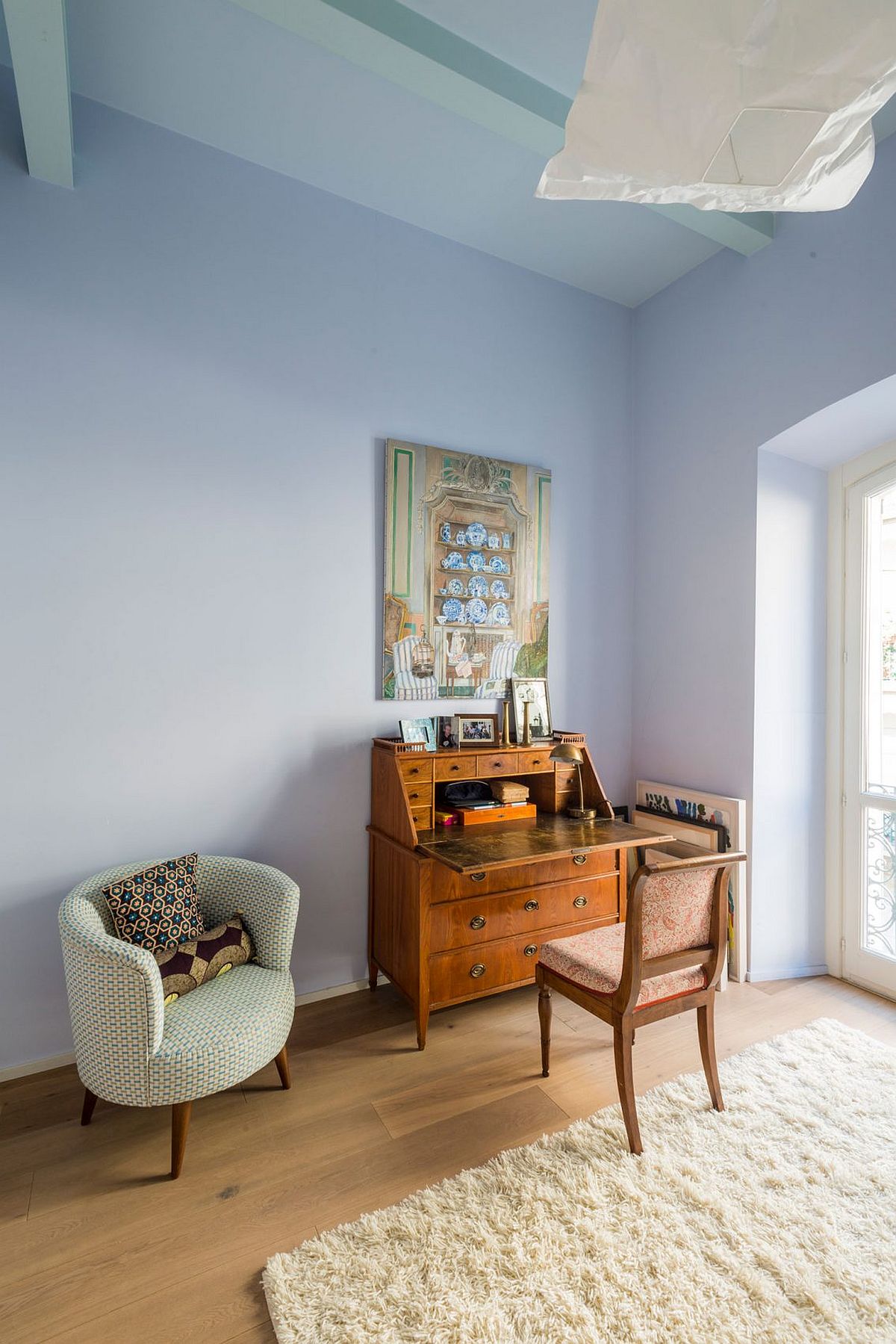 Home workspace with a classic desk and a cozy chair