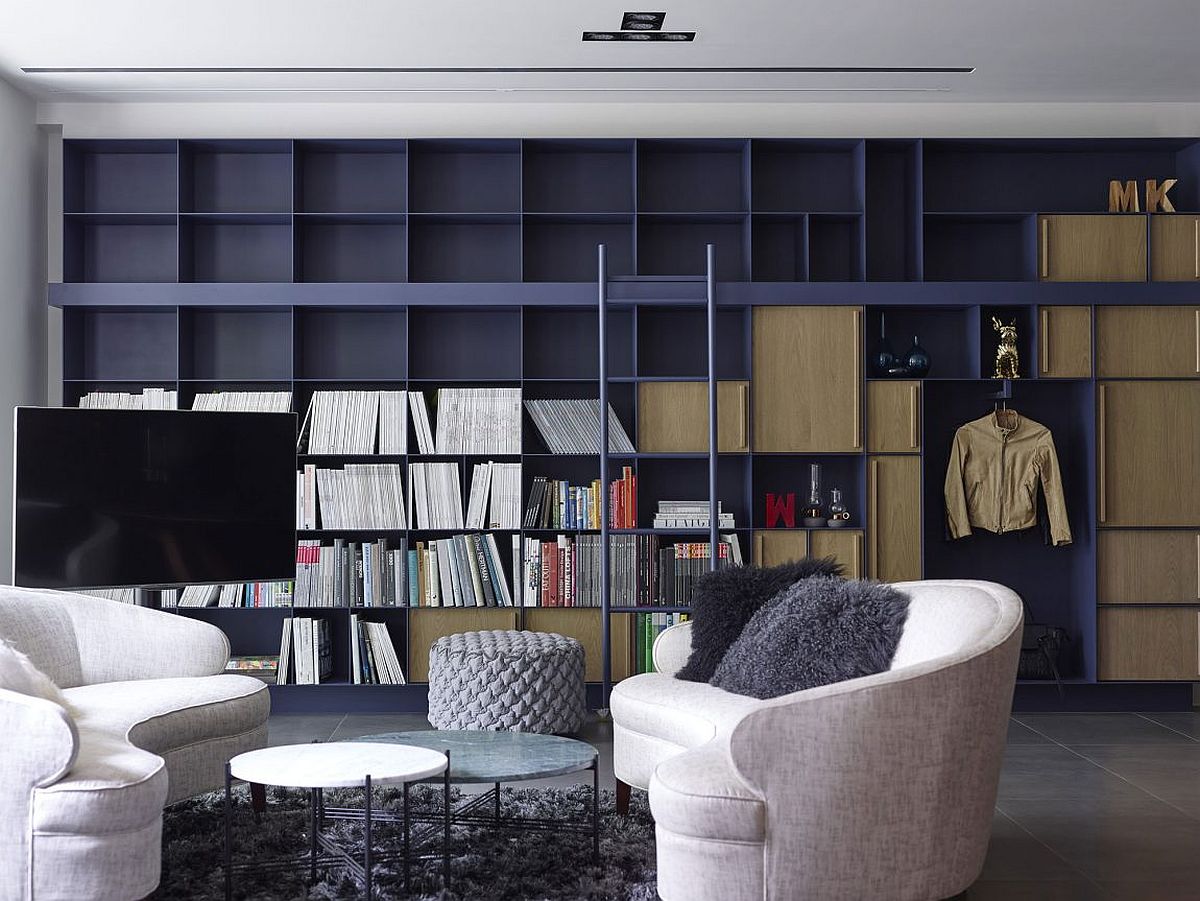 Large floor-to-ceiling open bookshelf in the living room