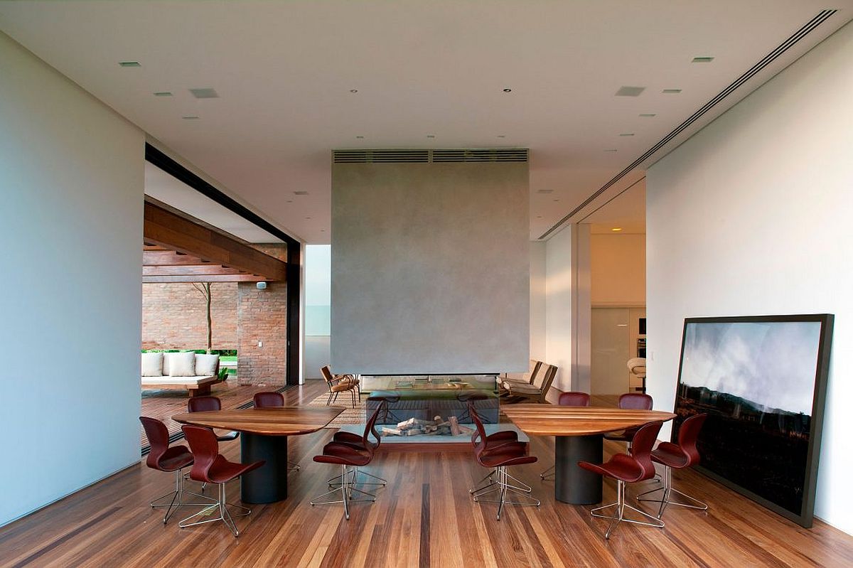 Living room with fireplace and a suspended chimney