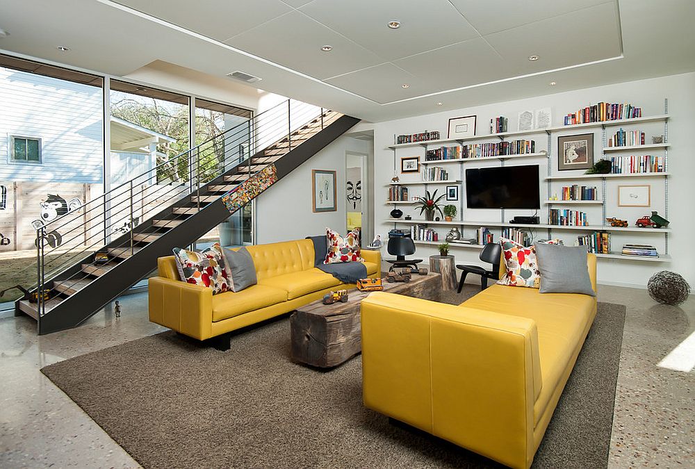 Midcentury living room with a yellow couch and lounger [Design: Foursquare Builders]