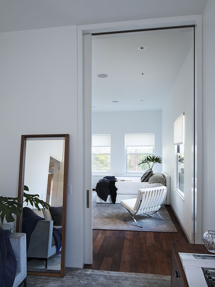 Mirror placed casually on the floor adds to the ambiance of the bedroom