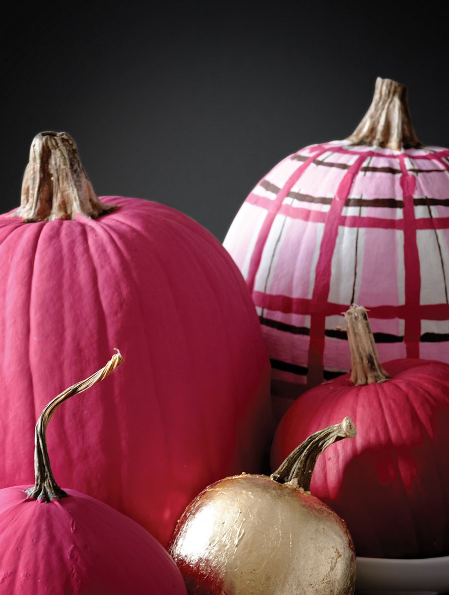 Mix different hues and patterns to create an eclectic collection of painted pumpkins this Halloween