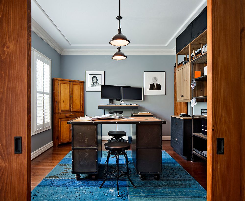 Modern industrial home office in gray with a bright blue rug [From: CM Natural Designs / Chipper Hatter]