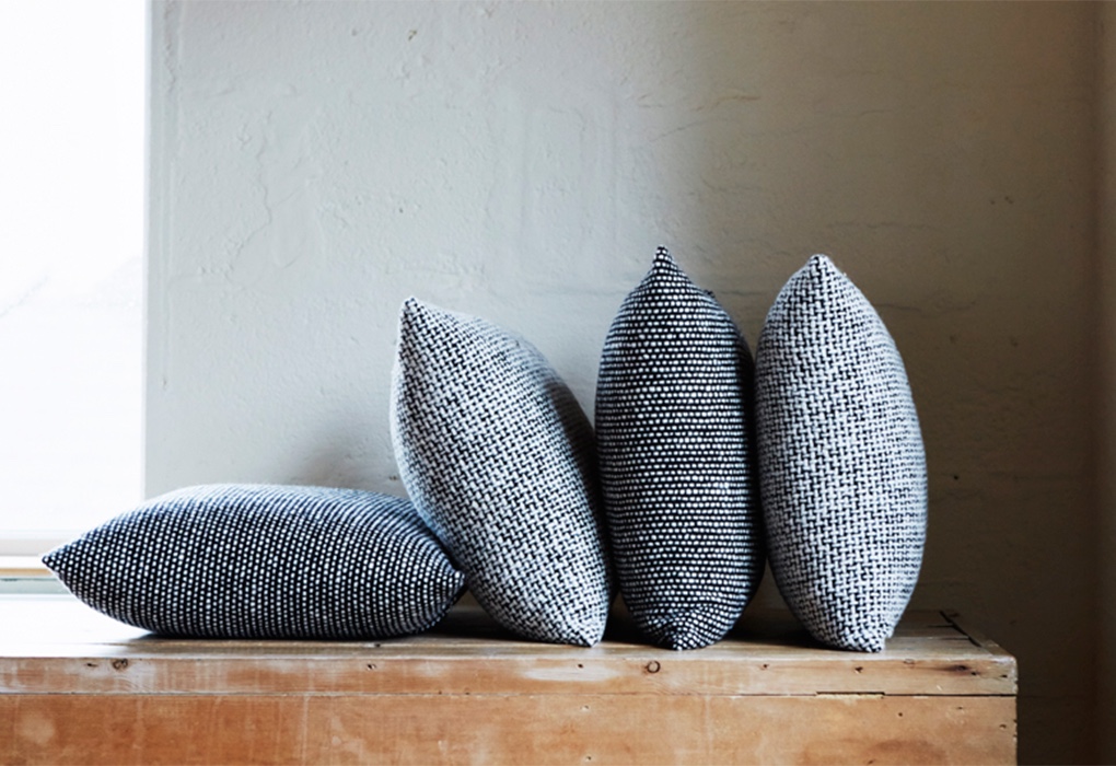 Mourne Tweed cushions designed by Gerd Hay-Edie for Mourne Textiles. Image via twentytwentyone.