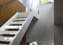 Open-glass-and-marble-stairs-connect-the-various-levels-of-the-new-and-improved-triplex-217x155