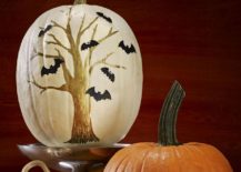 Painted-pumpkin-brings-a-touch-of-spooky-charm-to-the-Halloween-setting-217x155