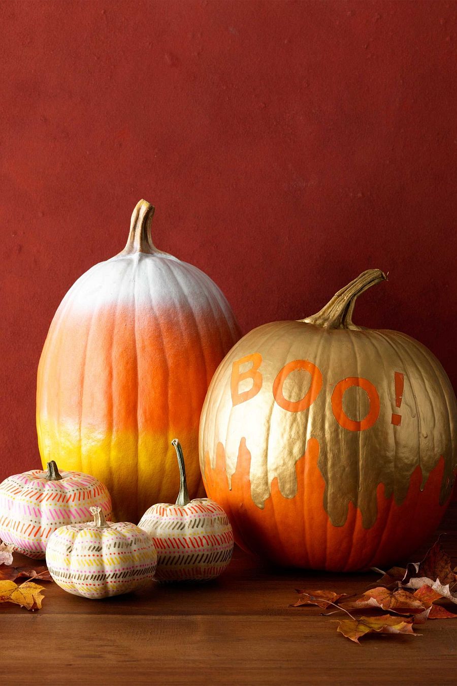 Painted pumpkins in gold and orange work well throughout the year
