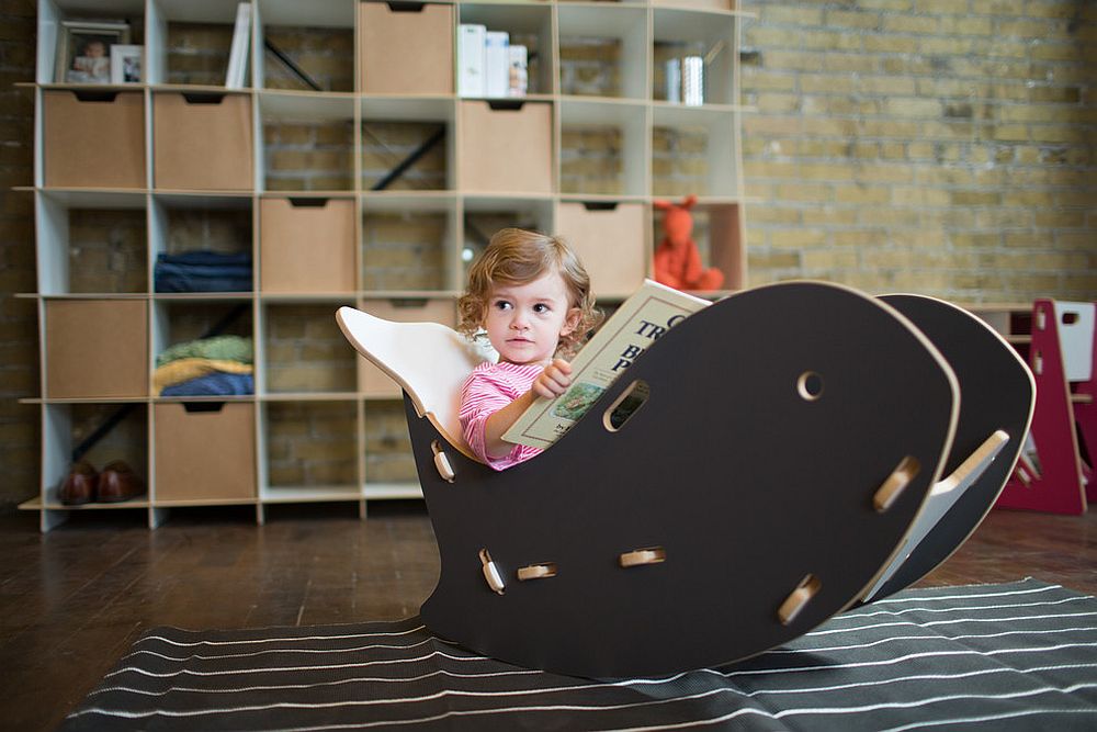 Quirky decor additions like the whale chair allow you to add black to the nursery in style