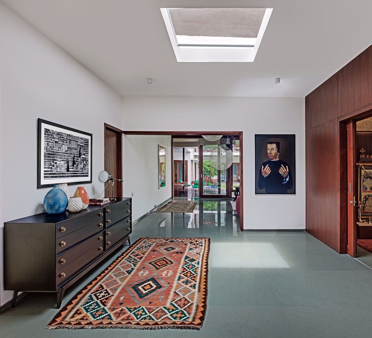 Skylight, traditional rugs and cool decor create a relaxing and light-filled interior
