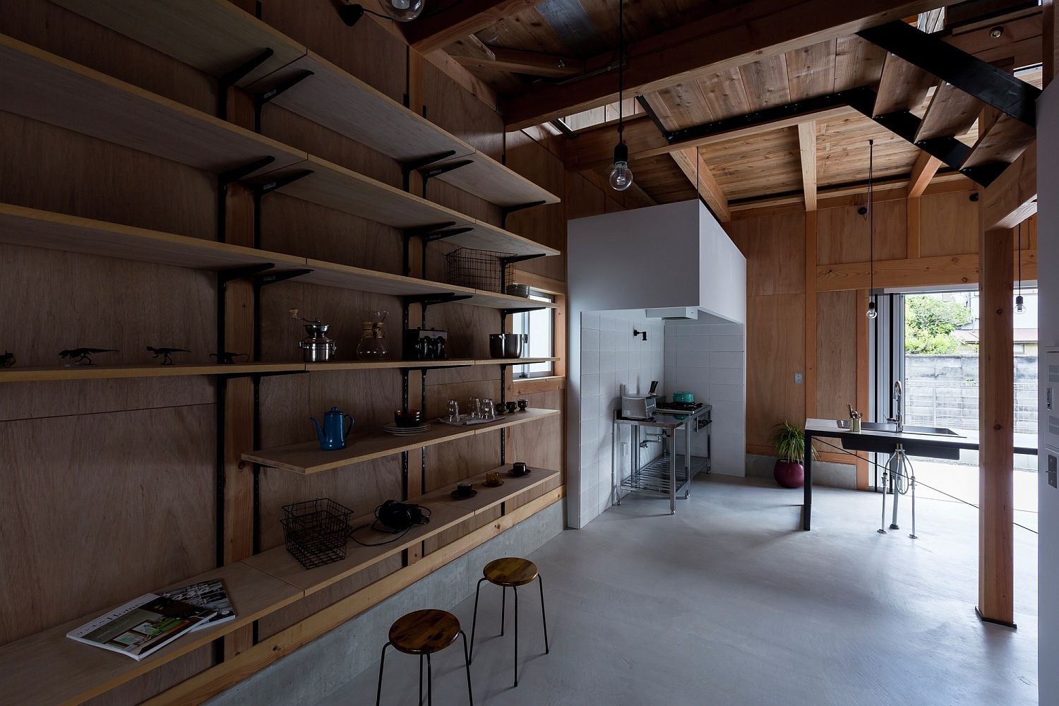 Sleek wooden shelves and open spaces offer flexible and minimal living environment