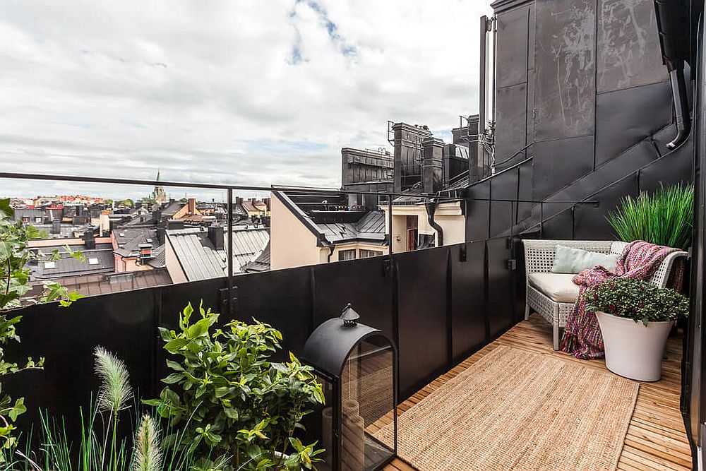 Small and comfy balcony of the stylish attic apartment