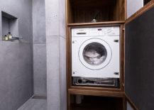 Space-conscious-bathroom-design-that-also-holds-the-washing-machine-in-a-custom-cabinet-217x155