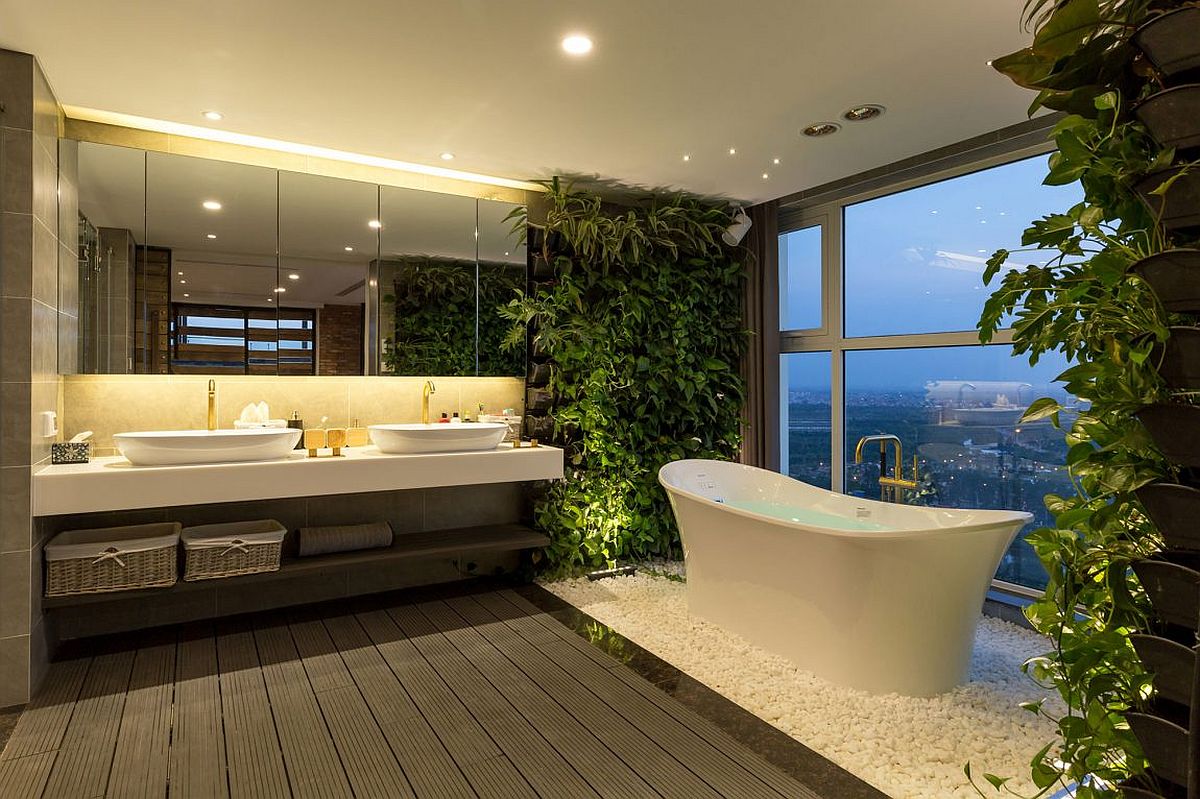 Stunning modern bathroom with standalone bathtub and living walls