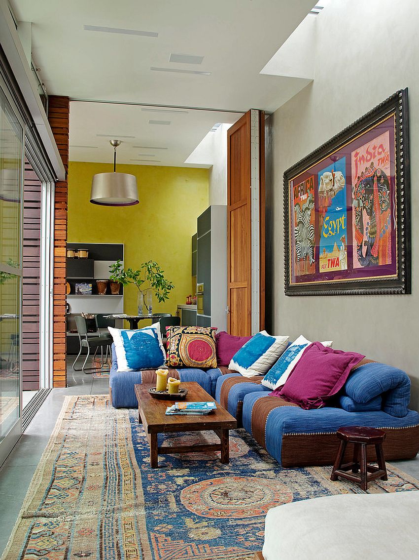 Stylish sofa brings color to the eclectic living room [Design: Katie Leede & Company Studio]