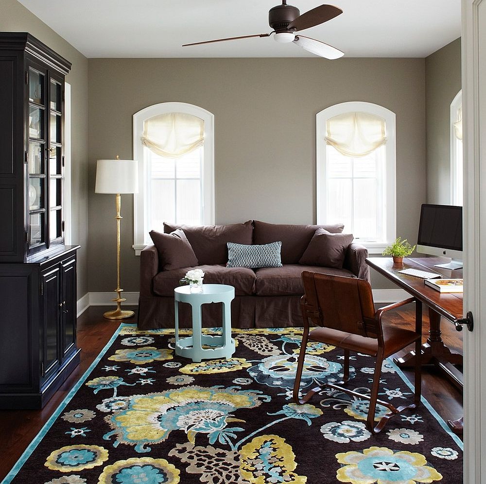 Traditional home office with a vibrant rug and gray walls