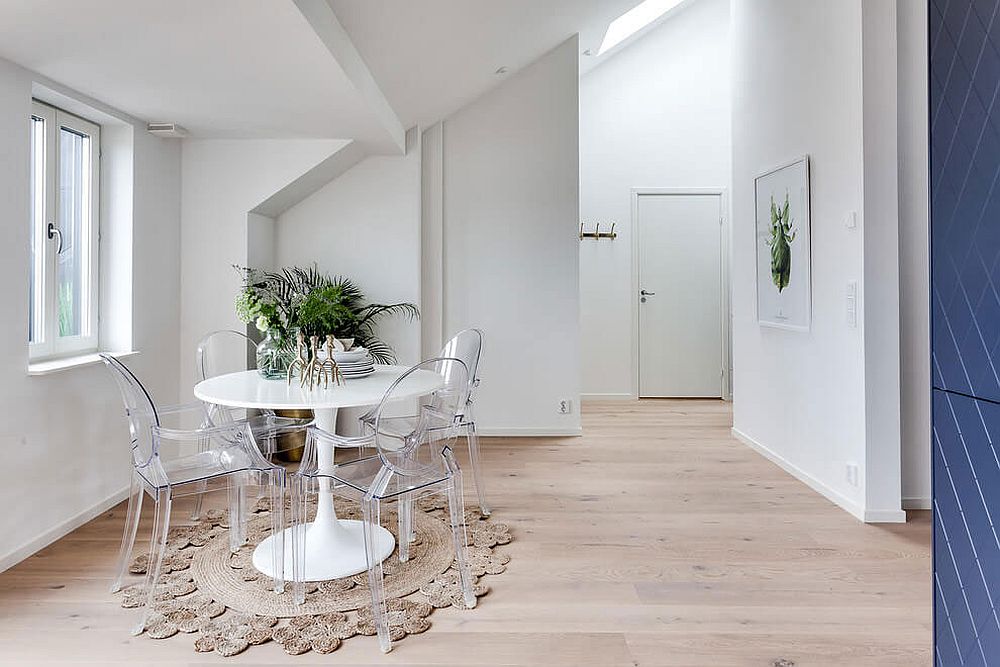 White round dining table and acrylic chairs for the tiny dining space