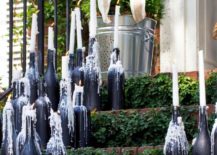 Wine-bottles-with-dripping-taper-candles-217x155