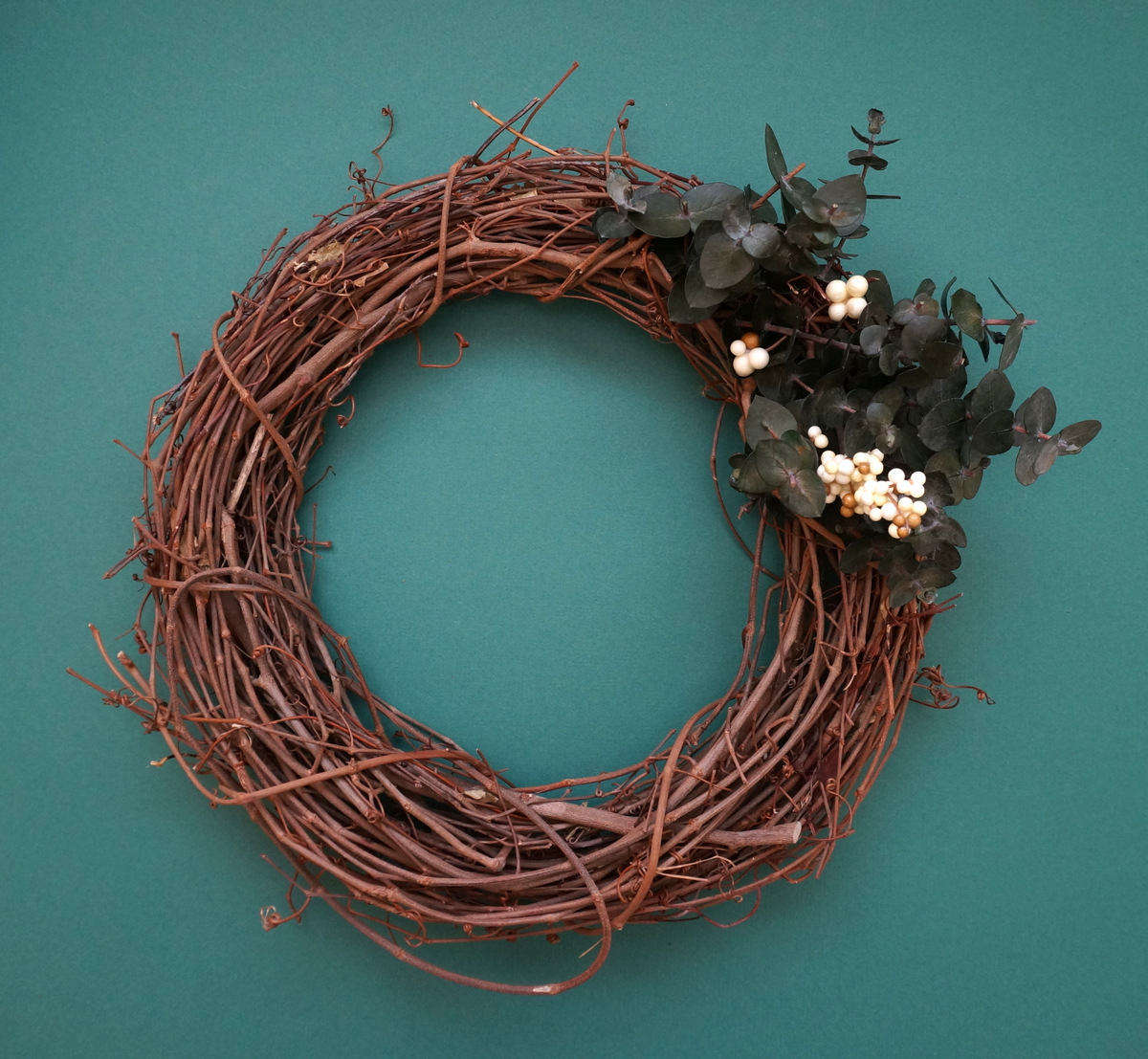 Begin decorating the top of the wreath