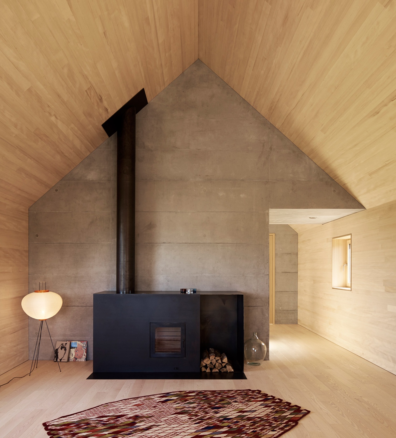 A cosy wood burning stove in an Austrian home designed by Bernardo Bader Architekten. Photo by Adolf Bereuter via Dezeen.