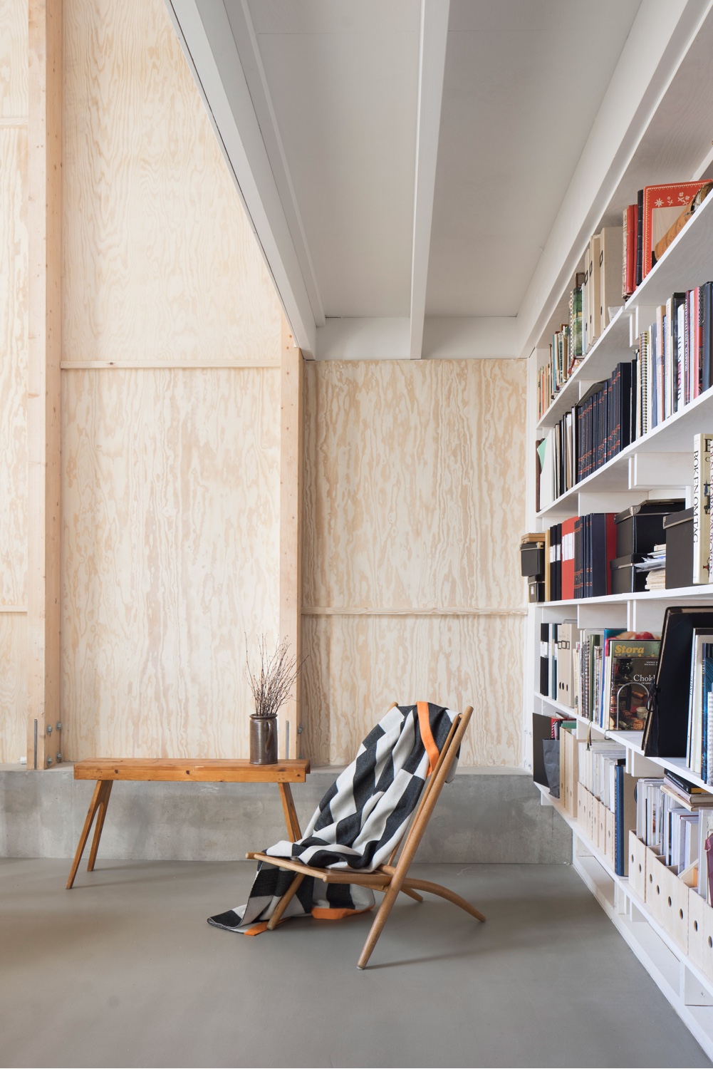 A cosy reading corner in a home designed by Björn Förstberg, co-founder of architectural studio Förstberg Ling. Photo by Markus Linderoth via Dezeen.