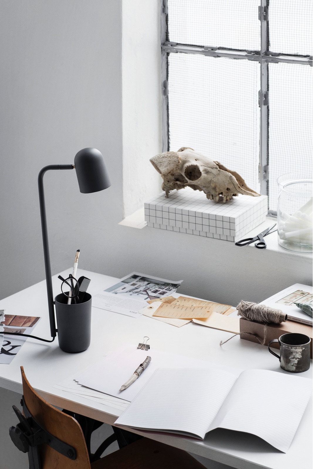 Designed by Mads Sætter-Lassen, Buddy (pictured in dark grey) is an unassuming little helper and desk companion.