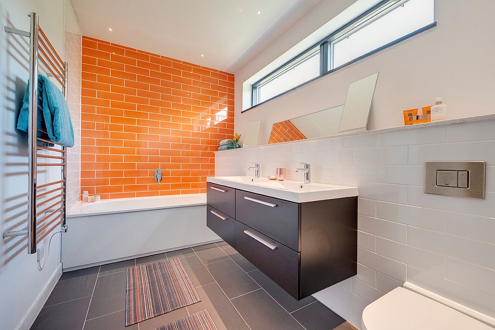 Contemporary bathroom in white, orange and gray [Design: van Ellen + Sheryn Architects]