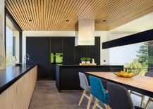 Contemporary-kitchen-in-black-and-wood-along-with-smart-dining-217x155