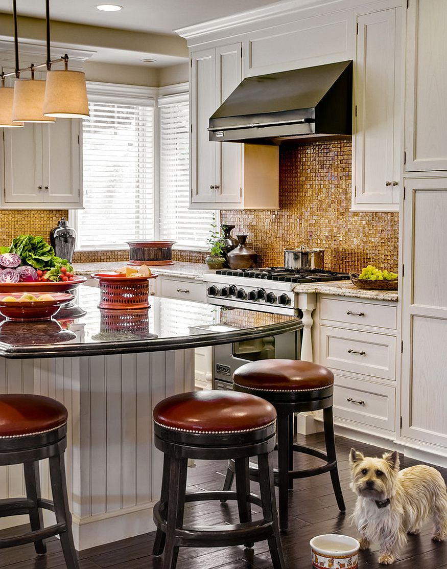 Dashing kitchen backsplash brings golden hue to the kitchen [From: Rutt of Los Altos / Dean J. Birinyi Photography]