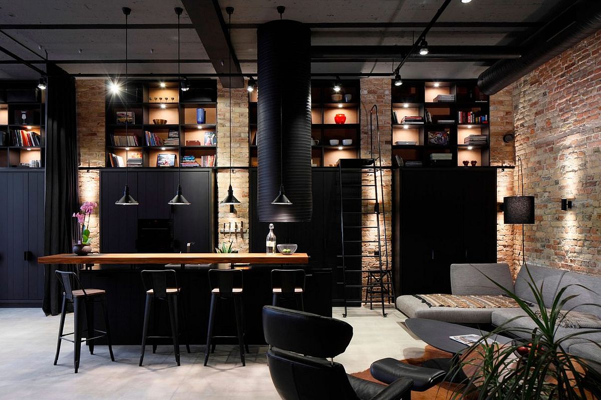 Exposed brick walls coupled with dark metallic decor creates the perfect industrial home