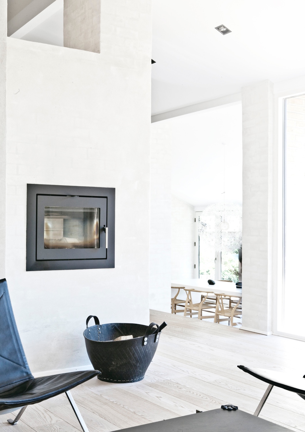 A cosy fireside corner in Fredensborg House designed by Norm Architects. Photo © Jonas Bjerre-Poulsen via ArchDaily.