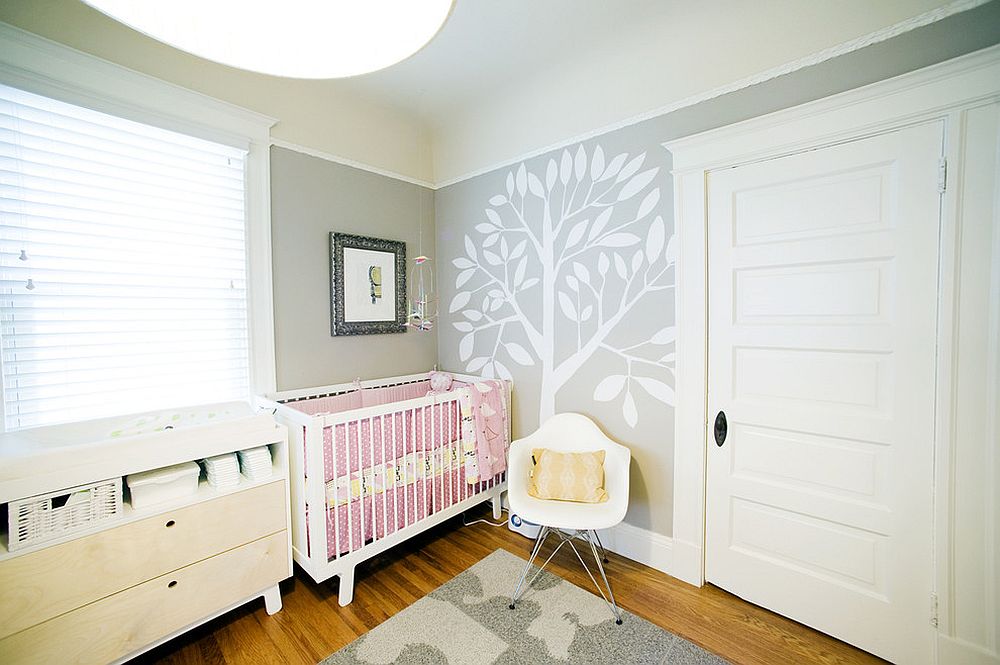 Gender neutral nursery in gray with a dash of pink