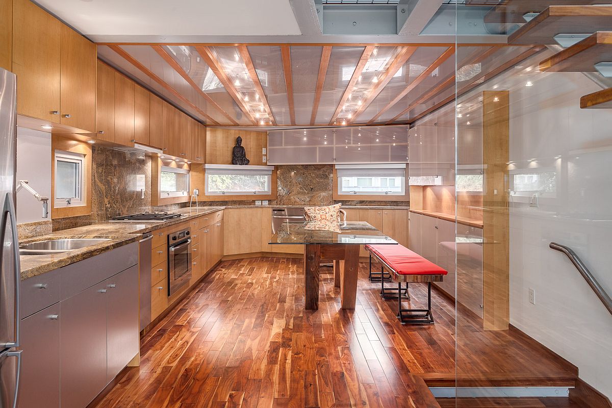 Glass ceiling brings natural light into the kitchen below