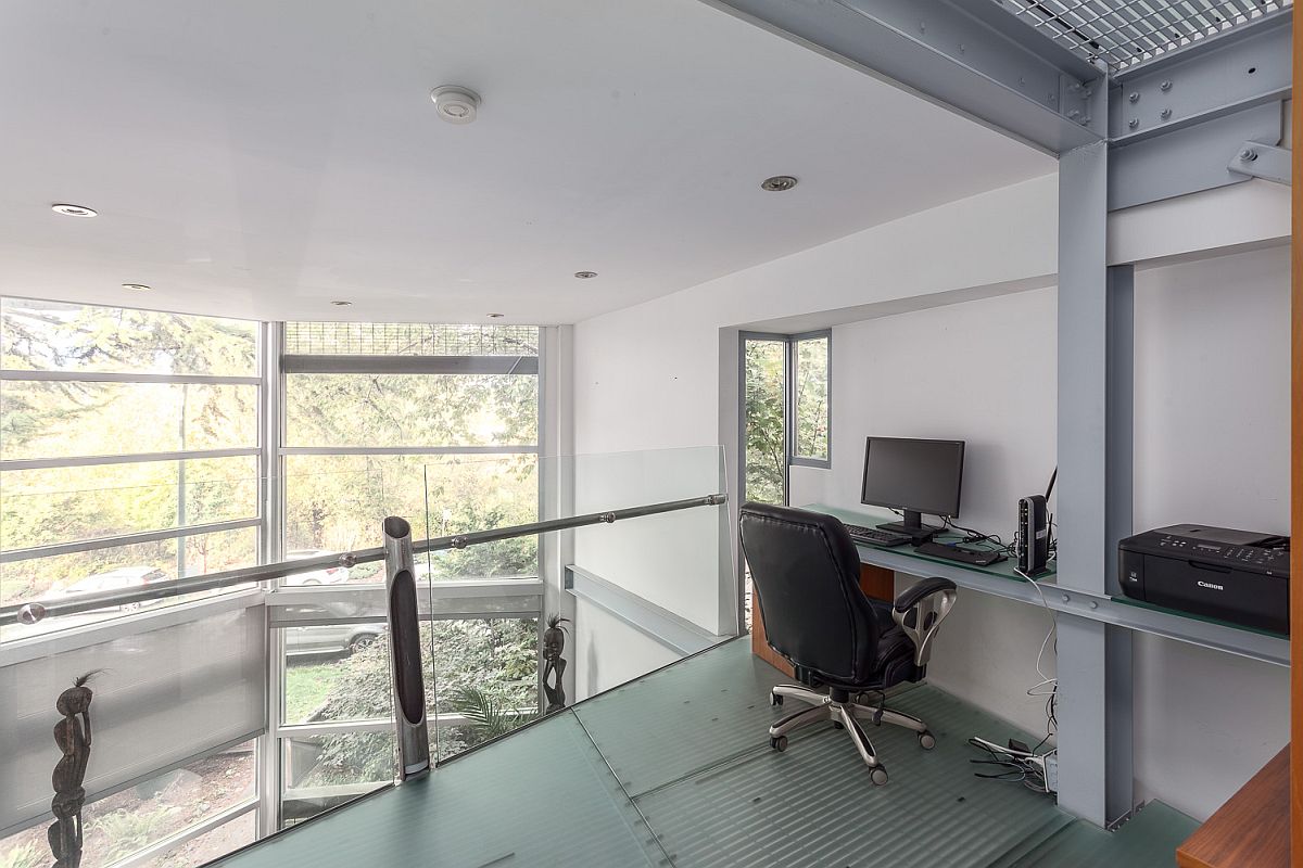 Home workspace on the top level of the duplex overlooking the living area below