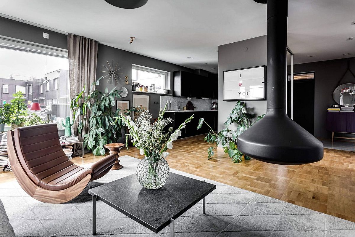 Indoor plants give teh Scandinavian apartment a refreshing and natural vibe