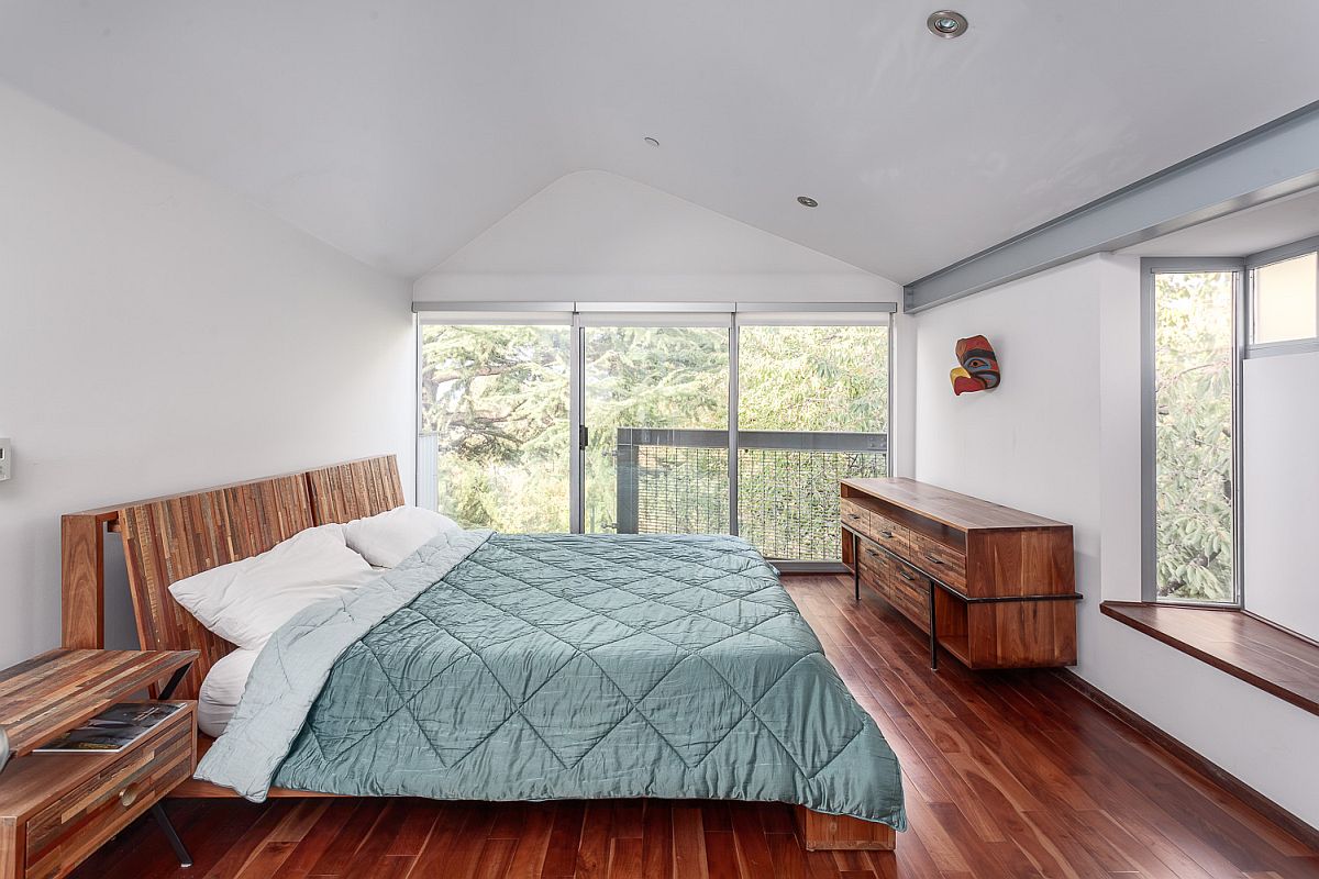 Large windows and skylight bring ample light into the bedroom