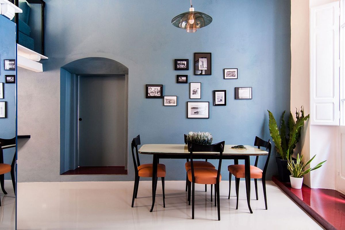 Light blue walls in the dining room create a sense of relaxed spaciousness