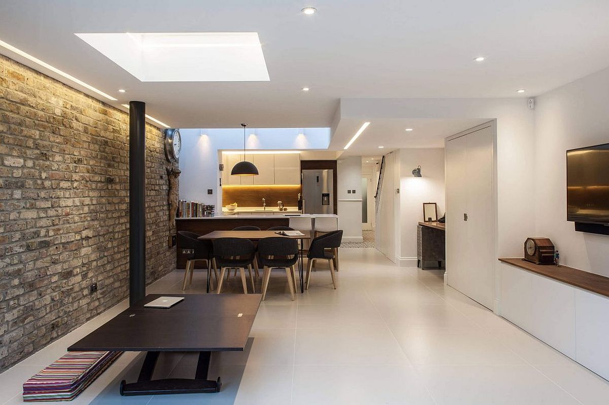 Light-filled living area of the London home with kitchen and dining space