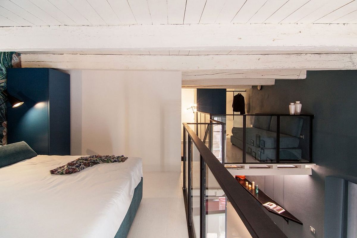 Mezzanine level bedroom and sitting area of the small Italian home