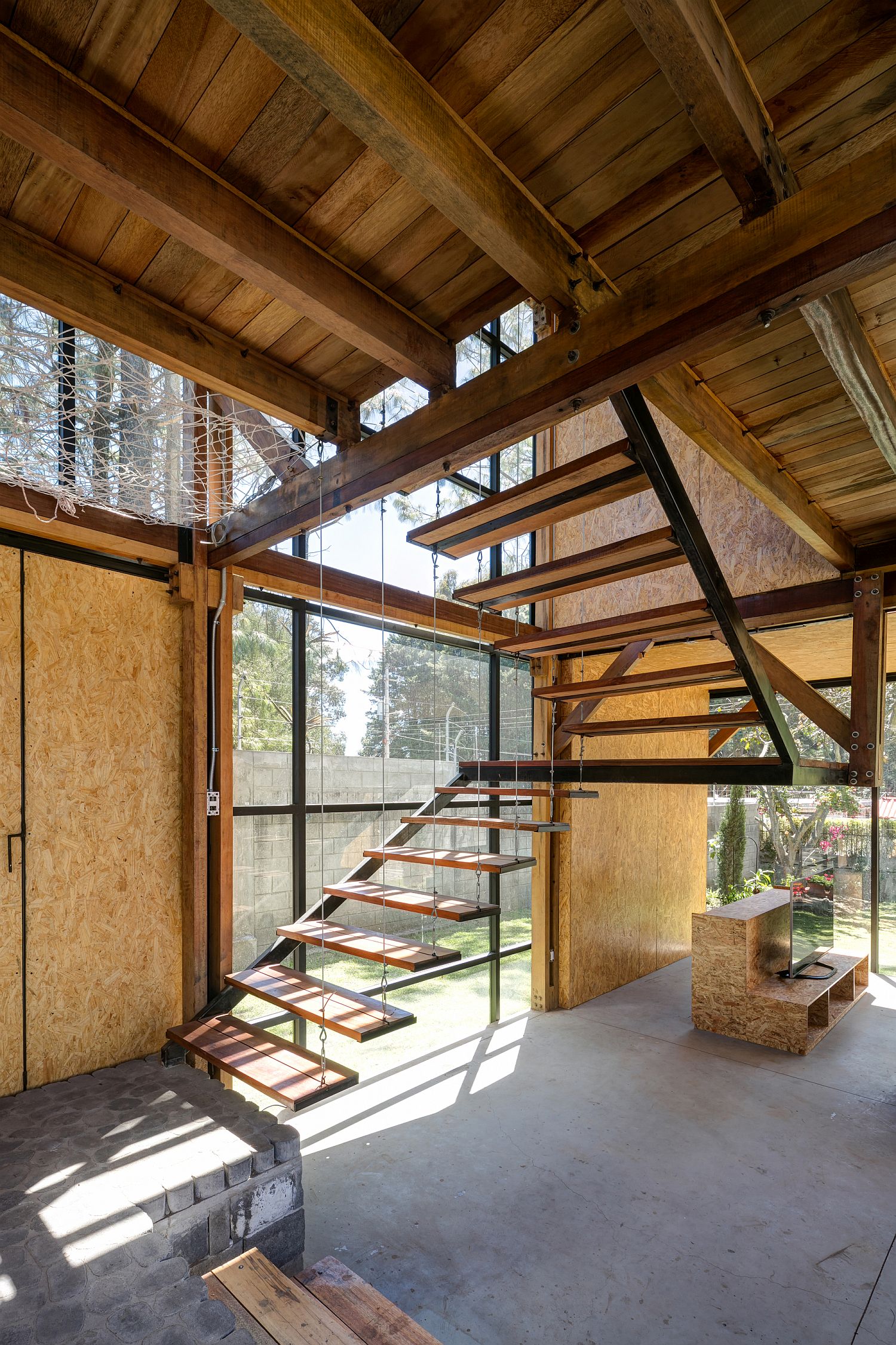 Minimal and modern staircase connects the various levels of the house