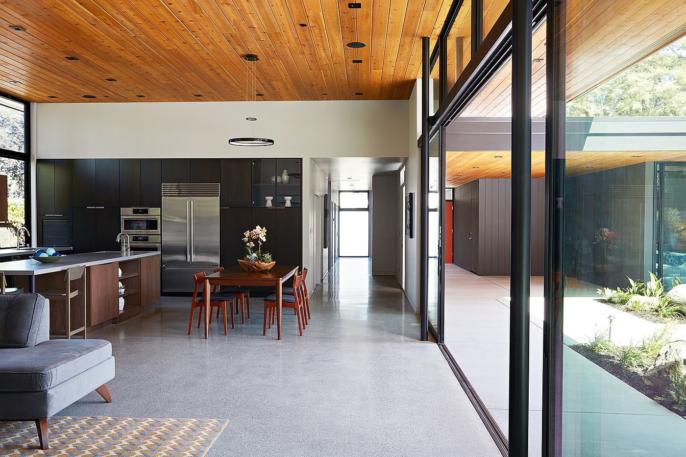 Neutral color scheme and wooden ceiling gives the home that classic Eichler appeal
