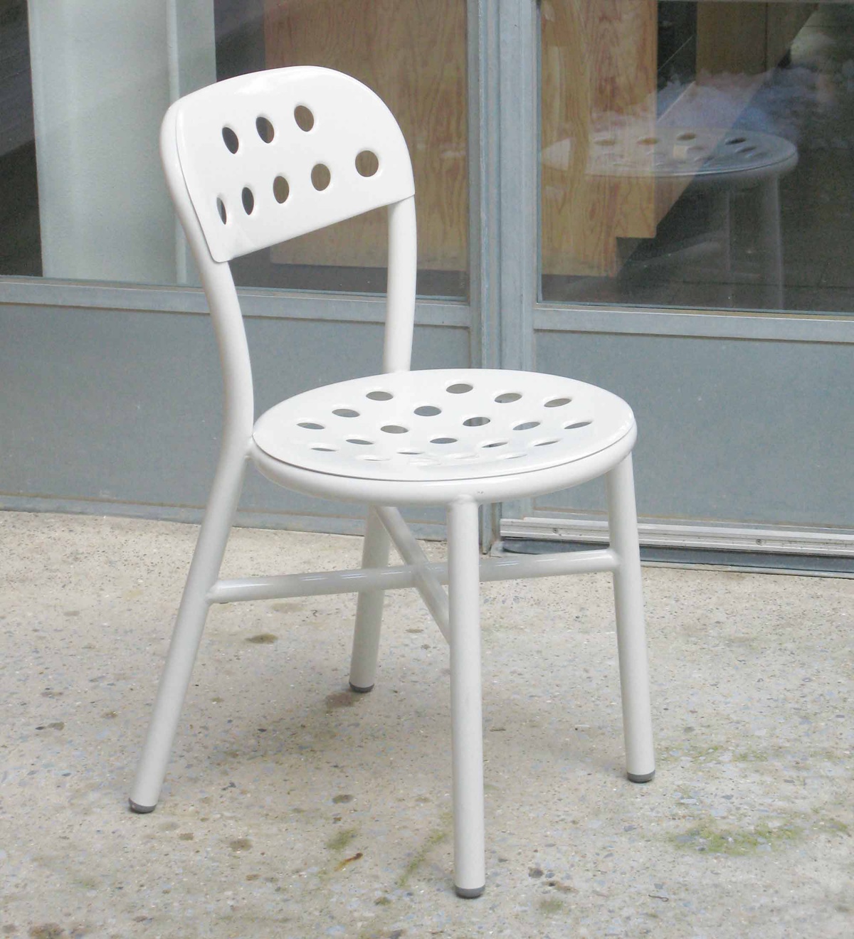 Pipe Chair (2008). Pipe is made using tubular aluminium with a seat and back in sheet aluminium (with holes for outdoor use) or high-pressure resinated plywood (for indoor use). Photo: Jasper Morrison Studio.