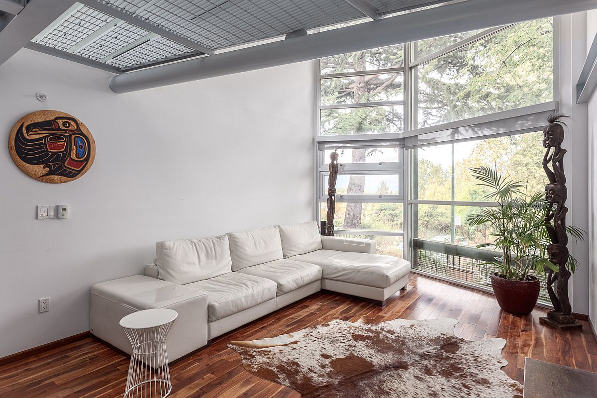 Sectional in the white living room adds to its color scheme