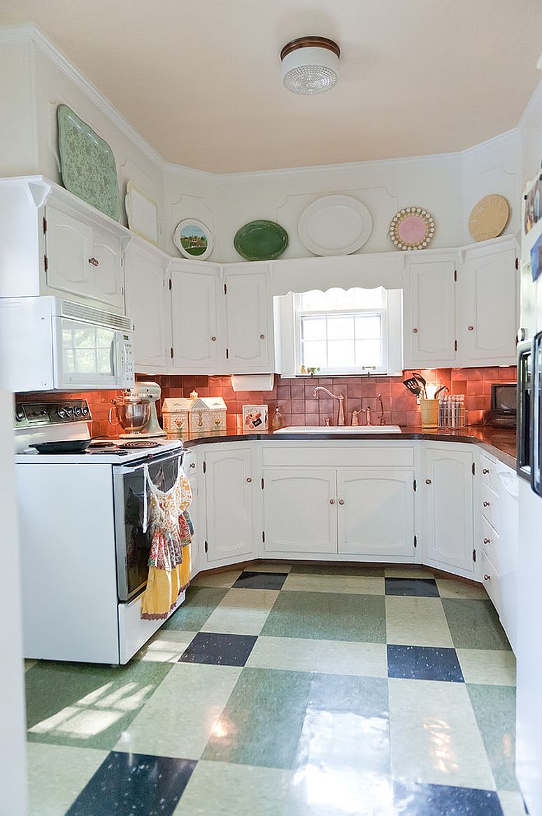 Shabby chic kitchen with space-savvy design and copper backsplash