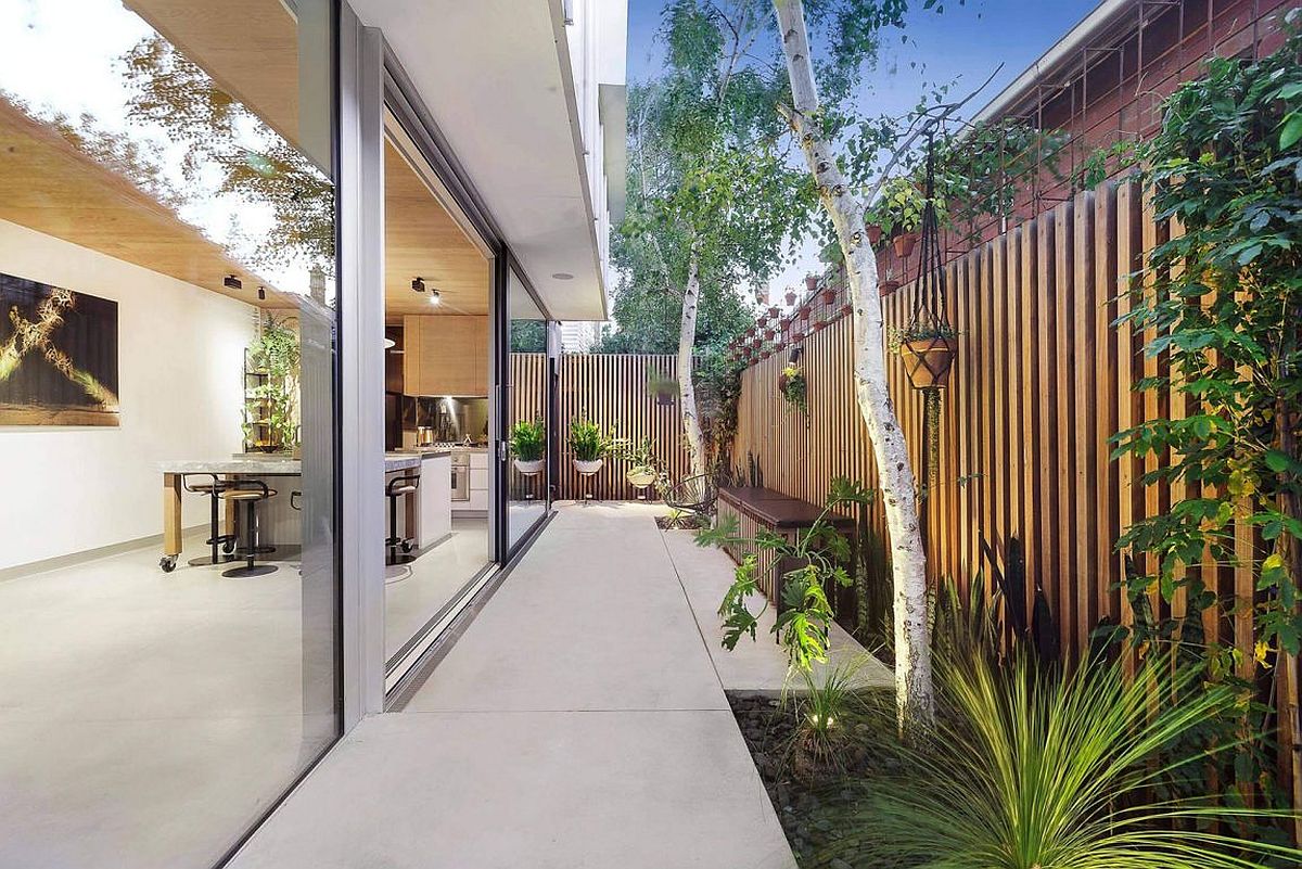 Sliding glass doors connect the interior with the rear hangout