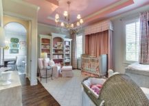 Spacious-traditional-nursery-in-gray-and-pink-with-play-area-217x155