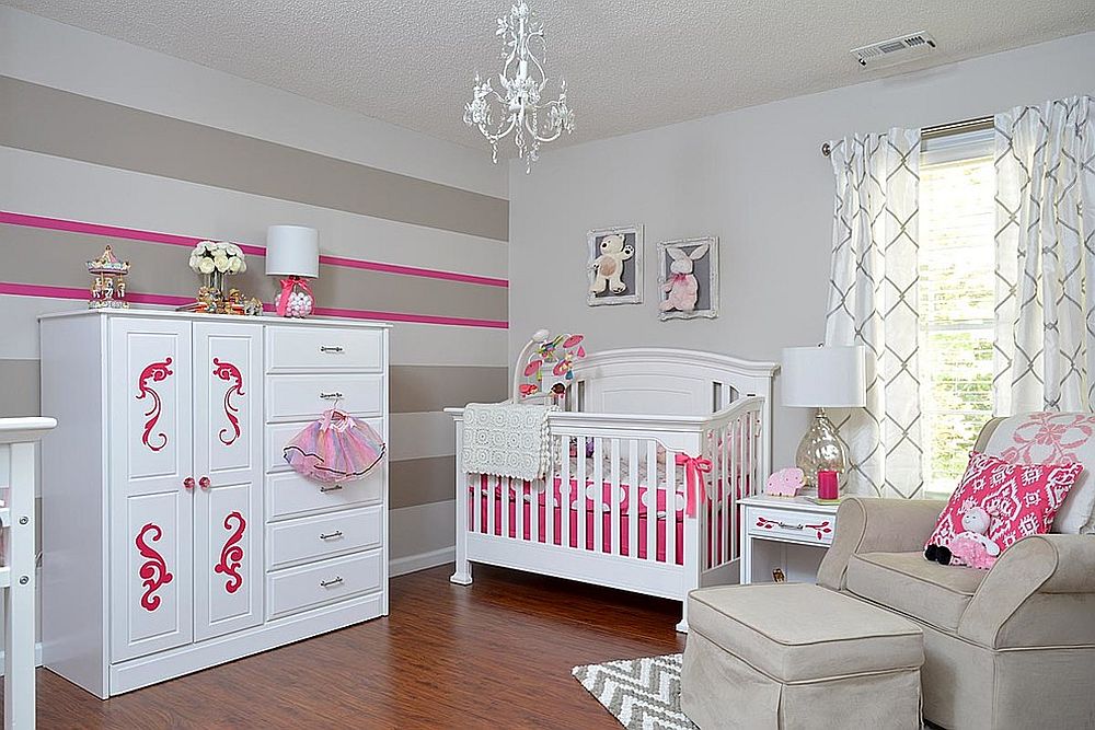 Striped accent wall in gray, white and pink for the modern nursery