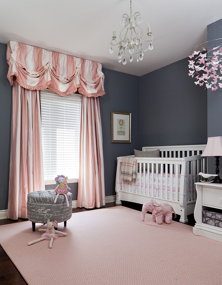 Pink and gray 2025 nursery with dark furniture