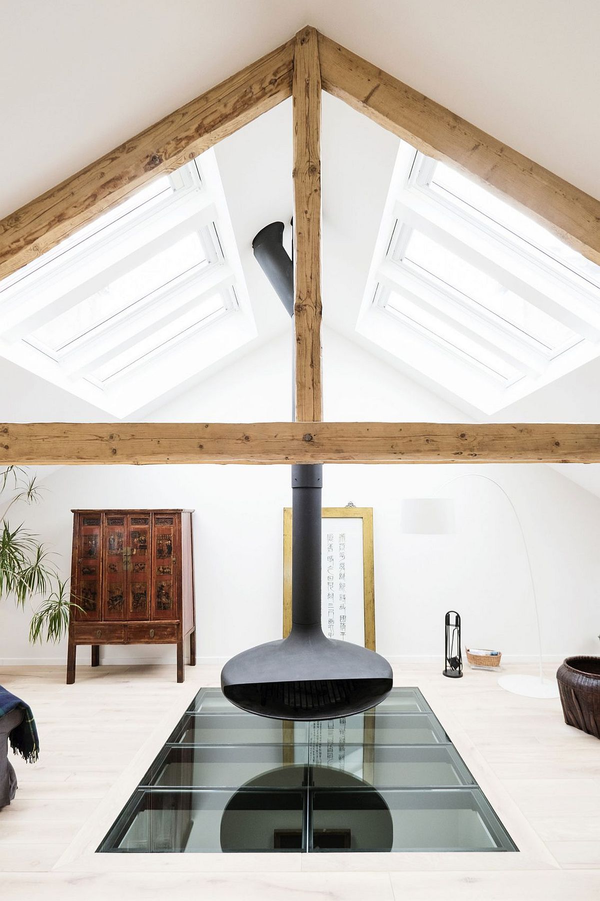 Stunning use of glass slab and contemporary fireplace for the loft living area