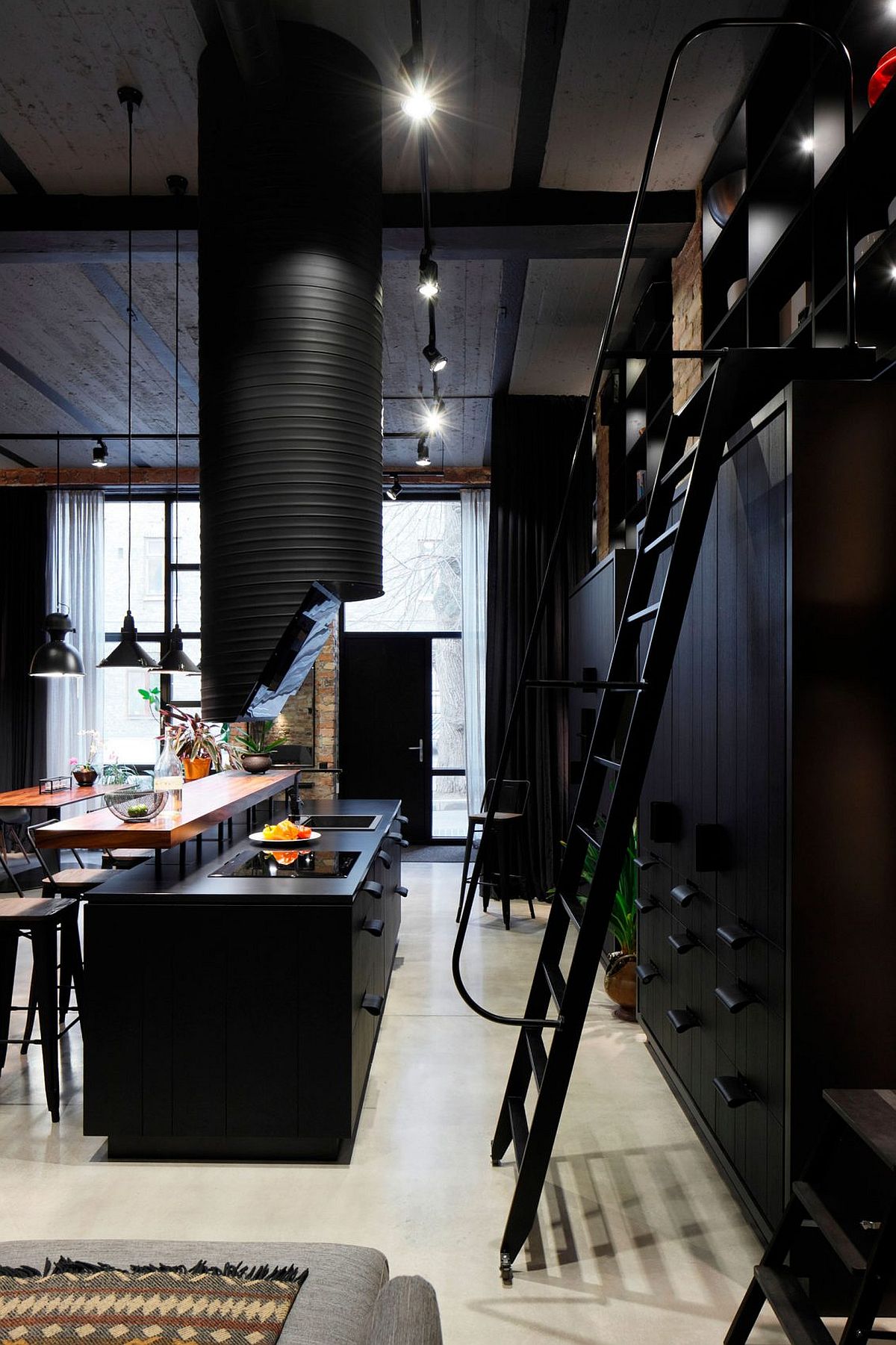 Stylish and dark industrial kitchen of the Latvian apartment