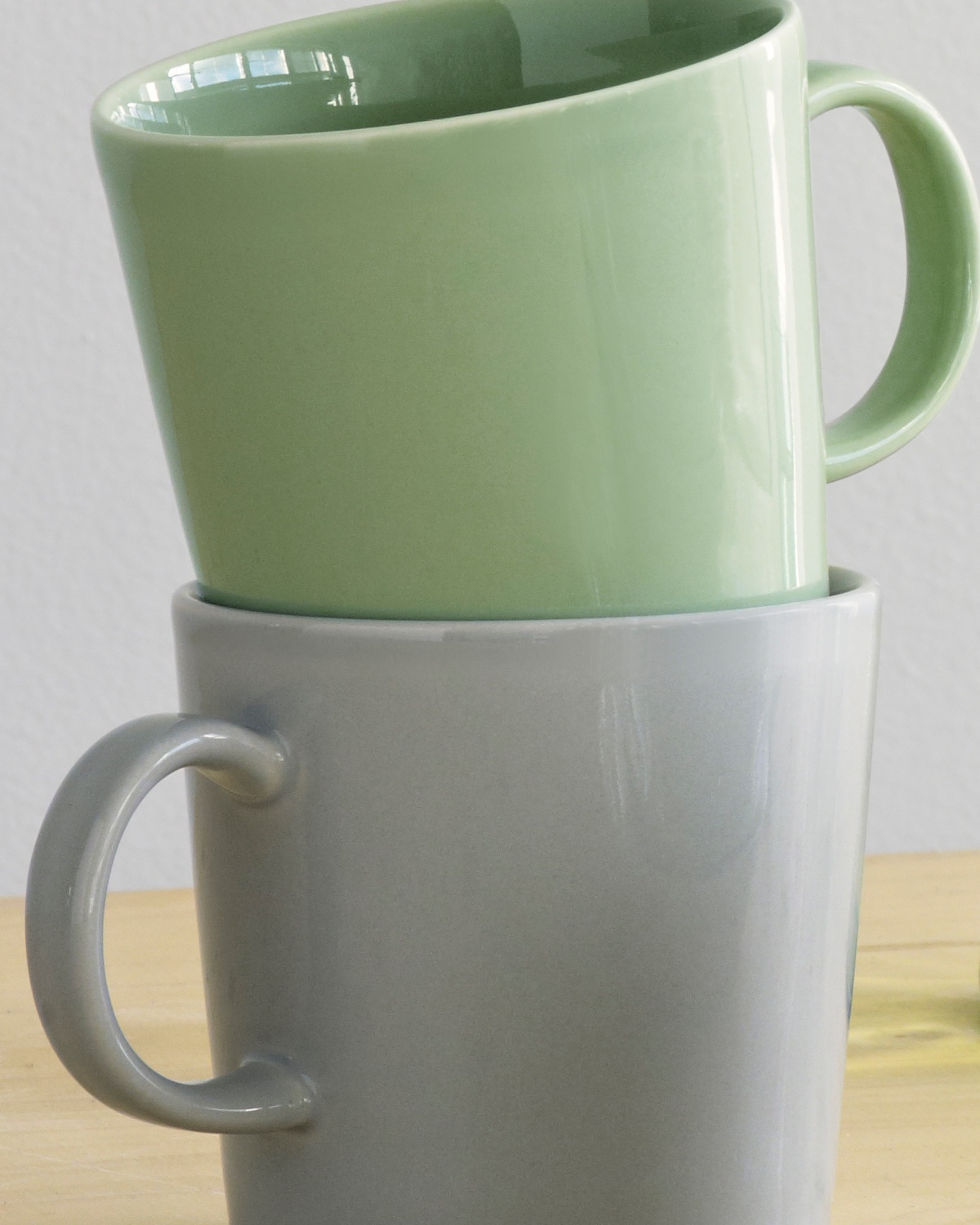 Teema mugs in pearl grey and celadon green.